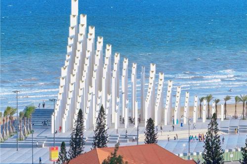 a large white building next to the beach at The Song Luxury Near Beach Apartment - Căn hộ Nghỉ Dưỡng Cao Cấp Cạnh Biển - Moonlight Homestay in Vung Tau