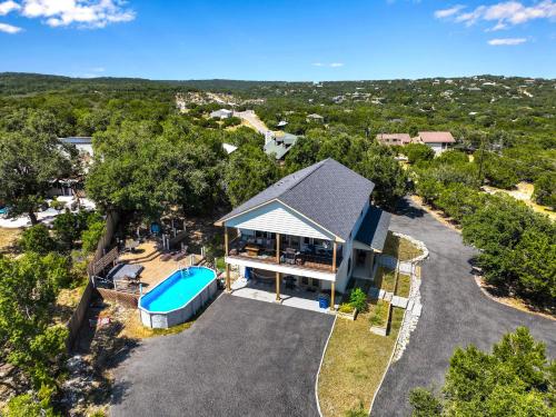 an overhead view of a house with a swimming pool at Scenic Terrace in Canyon Lake