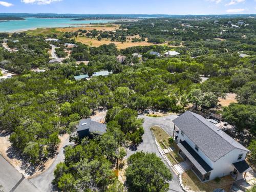 an aerial view of a house with trees and water at Scenic Terrace in Canyon Lake