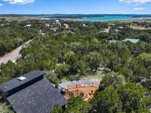 an overhead view of a house with a black roof at Scenic Treehouse in Canyon Lake