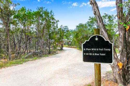 a sign at the end of a dirt road at Wild Candy-Plum Wild in Wimberley