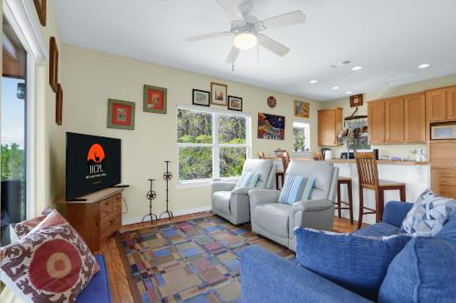 a living room with a blue couch and chairs at Valley View in Fischer