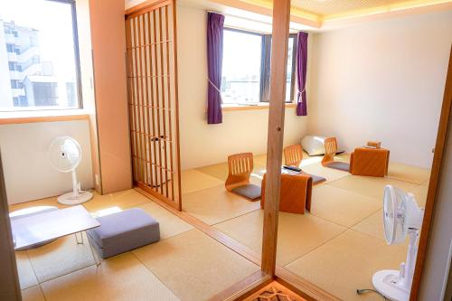 a bathroom with a toilet and a mirror at Hotel Imagine Kyoto in Kyoto