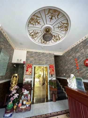 a building with a ceiling with a chandelier at King hotel in Dĩ An