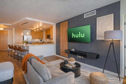 a living room with a hilton sign on a wall at Tranquil 1BR with Parking Gym Pool in Phoenix