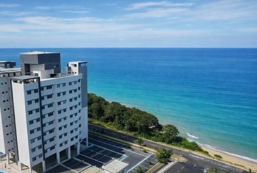 a view of the ocean from a building at Seaview Turtle Cove in Kampong Bugis