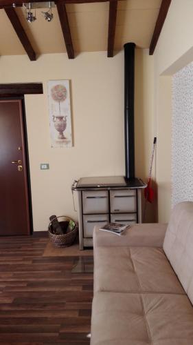 a living room with a couch and a table at Casa la Quiete in Torgiano