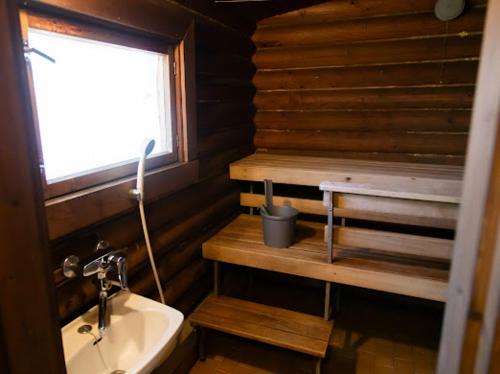 a small bathroom with a sink and a window at Eetuntupa in Keuruu
