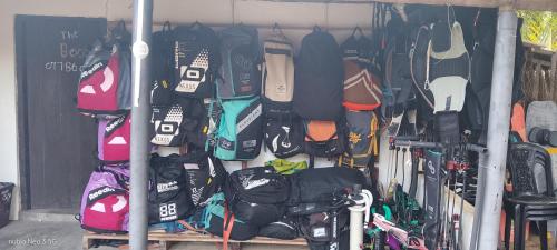 a rack of snowboards and other shoes on display at windy beach kite resort in Kalpitiya
