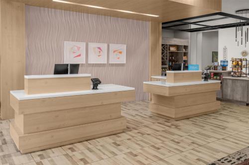 a lobby of a store with two checkout counters at Hilton Garden Inn Topeka in Topeka