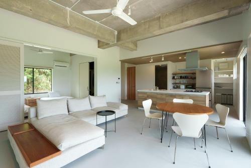 a living room with a couch and a table at Palm Hills in Ishigaki Island