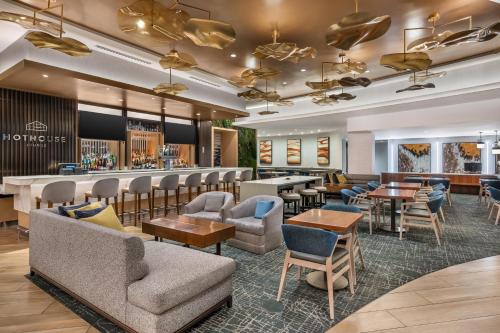 a lobby with tables and chairs and a bar at Hilton Grand Vacations Club Chicago Magnificent Mile in Chicago