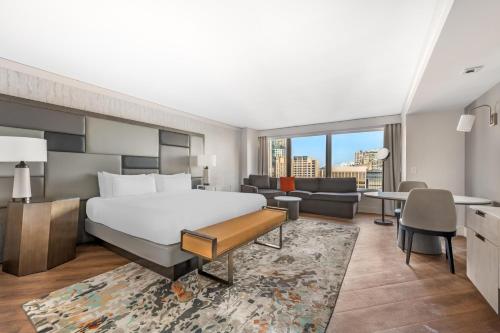 a bedroom with a bed and a living room at Hilton Grand Vacations Club Chicago Magnificent Mile in Chicago