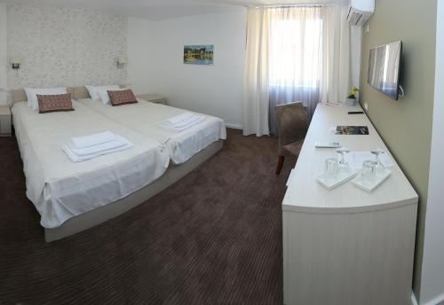Llit o llits en una habitació de Konačište Grad B&B