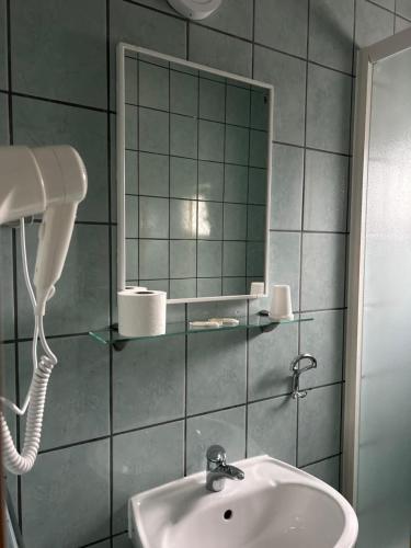 a bathroom with a sink and a mirror at Maća i Ante Pavlović in Međugorje