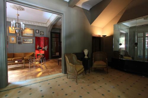 a living room with a couch and a table and chairs at -Casa Haydée- in Paysandú