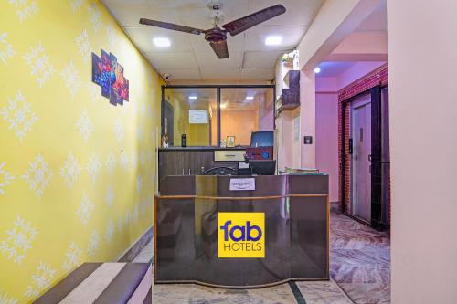 a lobby of a hotel with a ticket counter at FabHotel Relyef Inn in kolkata