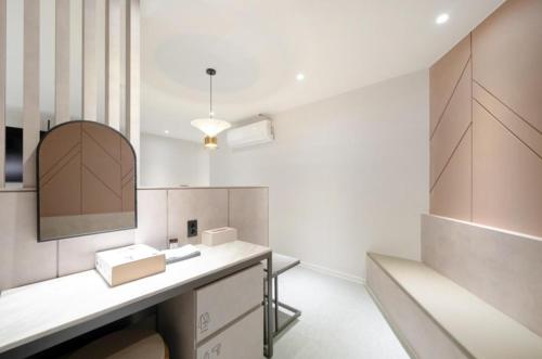 a bathroom with a sink and a mirror at 그루브 호텔 Groove Hotel in Jeonju