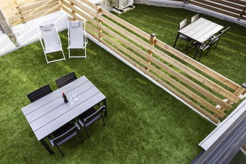 an overhead view of a patio with a table and chairs at Apartamentos Catamarán Azul in Suances