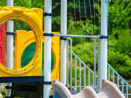 a playground with a slide in a park at Wonju Cloud Pension in Wonju