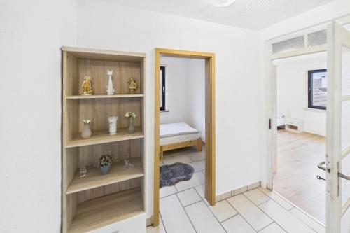 a room with a door leading to a bedroom at Ankas Ferienwohnung 2 in Bexbach