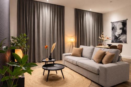 a living room with a couch and a table at Tilburg 2br apartment group friendly kitchen in Tilburg