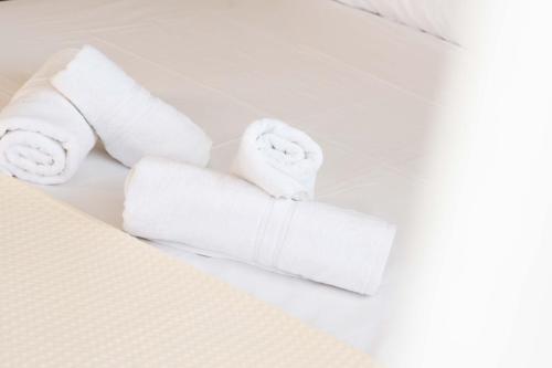 a pile of towels sitting on top of a room at Venetia Luxurious Villa in Iraklitsa