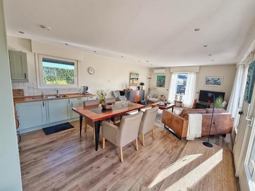 a kitchen and living room with a table and chairs at KRAB160 in Sint Annaland