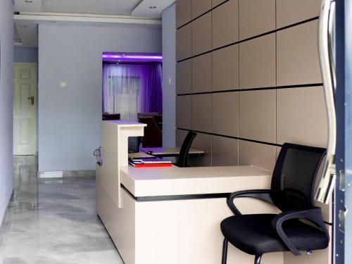 an office with two chairs and a desk at Mevis Boutique Hotel in Bulawayo