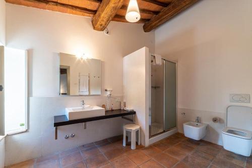 a bathroom with a sink and a toilet at Locanda Della Picca in Città della Pieve