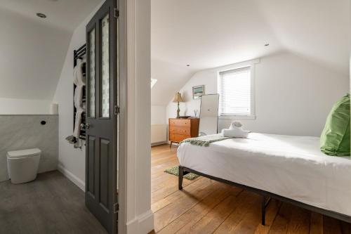 a bedroom with a large bed and a window at Rosemount - Kilrenny in Kilrenny