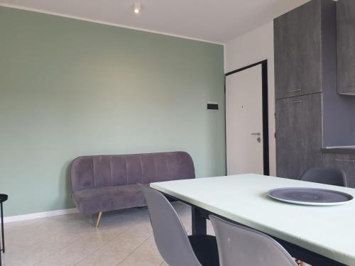 a room with a table and chairs and a couch at New N3-House by Anthea Homes in Casièr