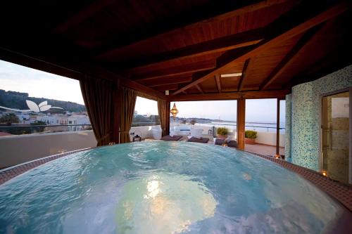a large pool in the middle of a house at Mira Spiaggia in San Vito lo Capo
