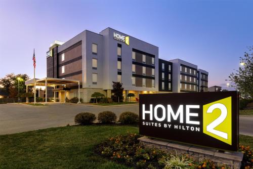 a home suites by infusion sign in front of a building at Home2 Suites By Hilton Dayton Vandalia in Dayton