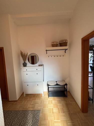 a room with a white dresser and a shelf at Altstadtgold in Rostock