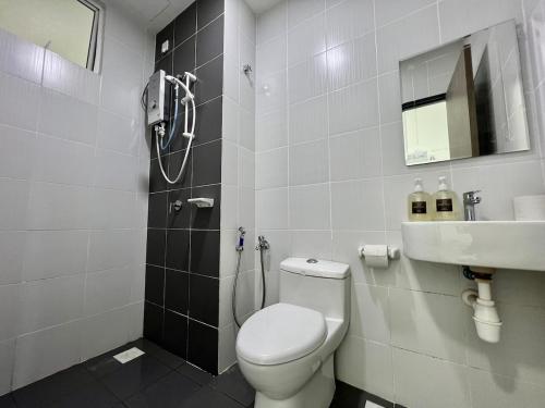 a bathroom with a toilet and a sink at Melaka Nova-8 Studio City-View-4pax in Malacca