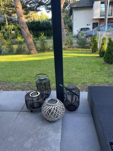 a group of four baskets sitting on a porch at Baltic Park in Rozewie