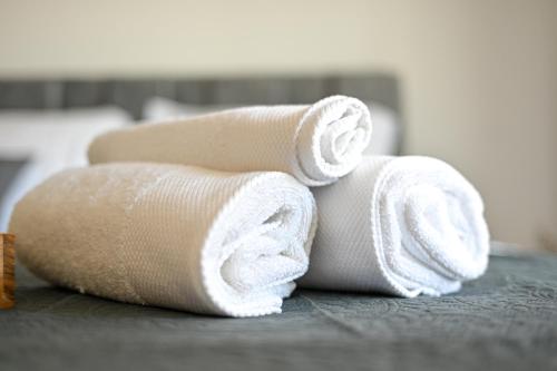 a pile of towels sitting on top of a table at apartmani sukošan in Sukošan