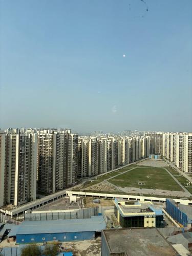 an aerial view of a city with tall buildings at Hotel Namaste With Jacuzzi in Ghaziabad