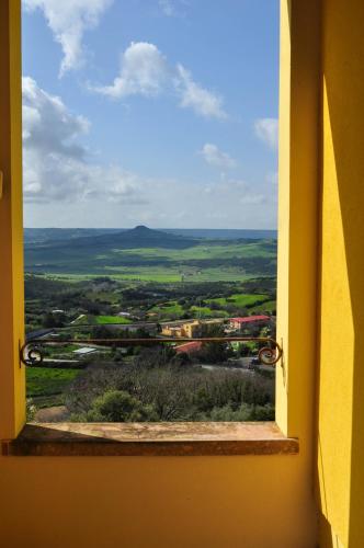 an open window with a view of a train at Il Glicine in Làconi