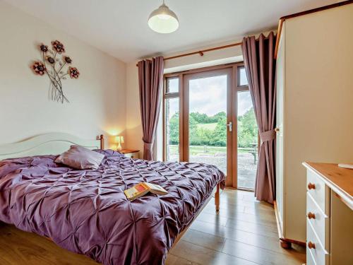 a bedroom with a bed and a large window at 3 Bed in Launceston oc-oldoa in North Hill