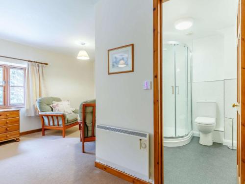 a bathroom with a shower and a toilet at 2 Bed in St. Austell oc-82609 in St Austell