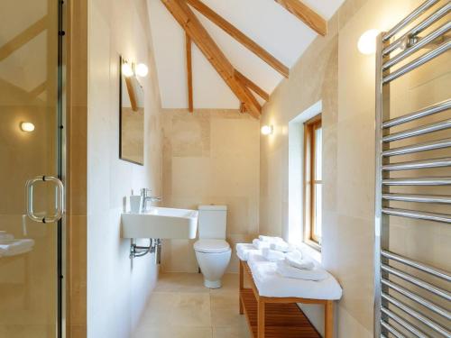 a bathroom with two sinks and a toilet at 3 Bed in Crackington Haven oc-78271 in Saint Gennys
