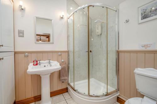 a bathroom with a shower and a sink and a toilet at 1 Bed in Winskill oc-c36298 in Little Salkeld