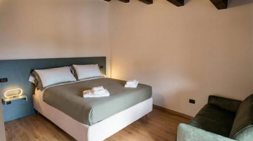 a bedroom with a bed with two towels on it at Casa Ereva in Bagnoli Irpino