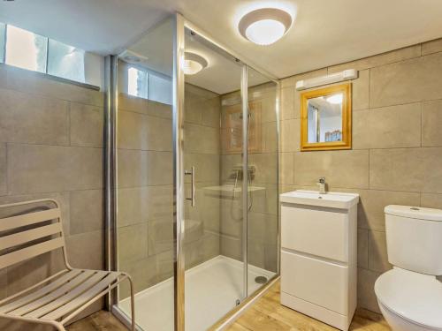 a bathroom with a shower and a toilet and a sink at 4 Bed in Bude oc-corys in Morwenstow