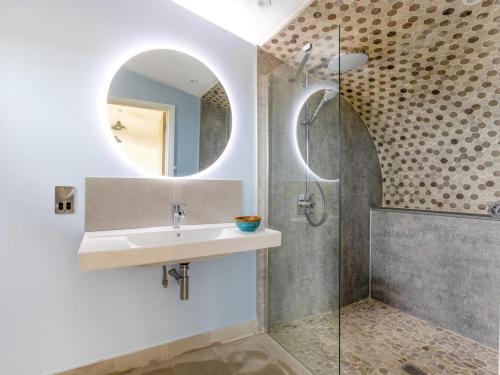 a bathroom with a sink and a shower at 1 Bed in Bude oc-88498 in Morwenstow