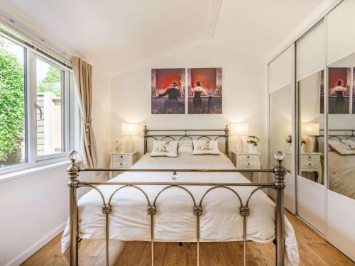 a bedroom with a bed with white walls at 1 Bed in Bodmin oc-88049 in Luxulyan