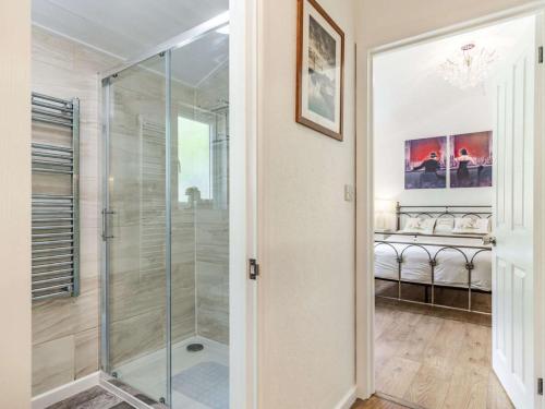 a bathroom with a shower and a glass door at 1 Bed in Bodmin oc-88049 in Luxulyan