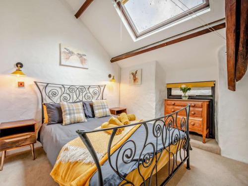 a bedroom with a bed and a skylight at 2 Bed in Bodmin oc-90216 in Bodmin